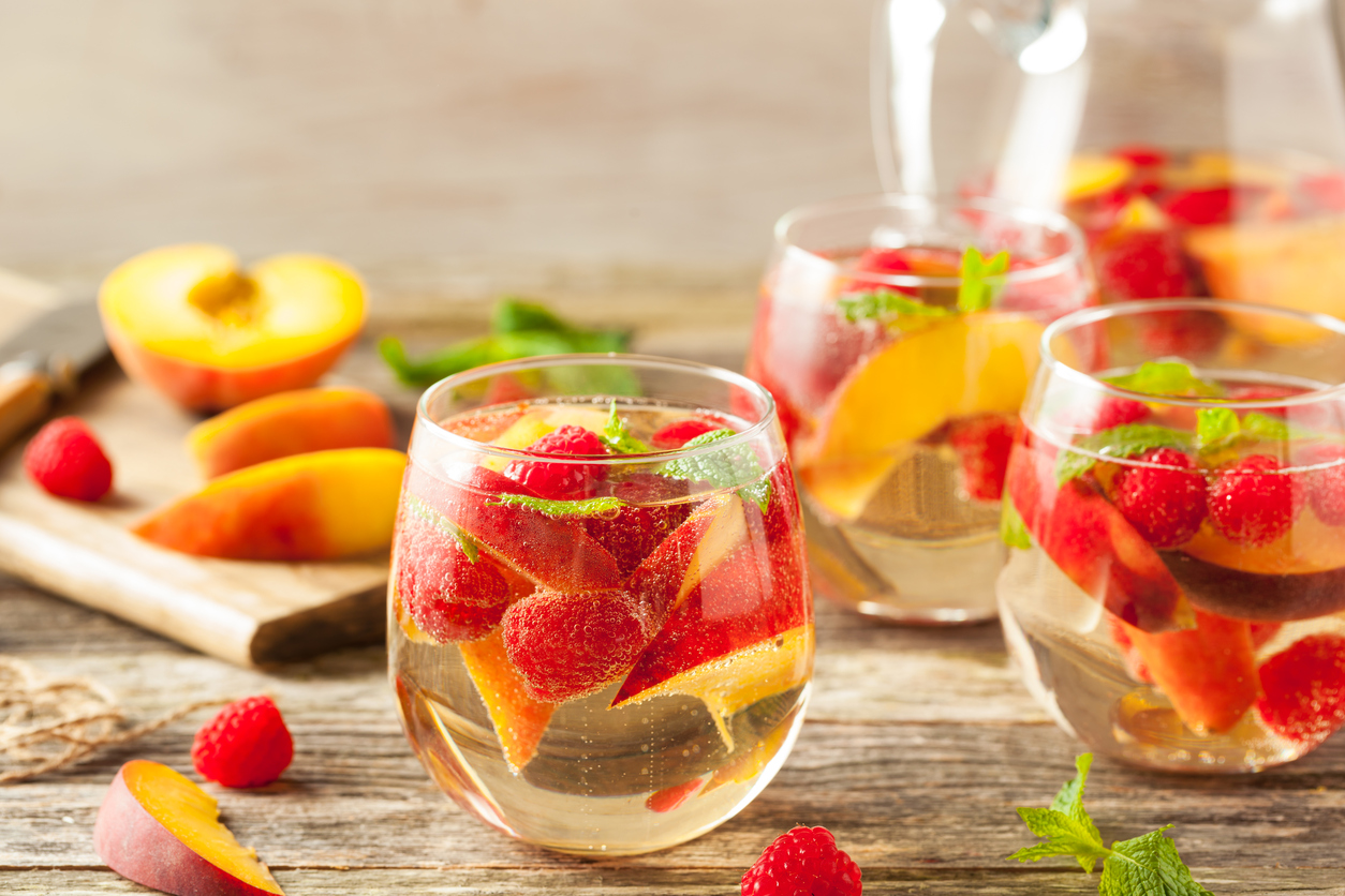 Homemade Sparkling White Wine Sangria with Peaches and Raspberries